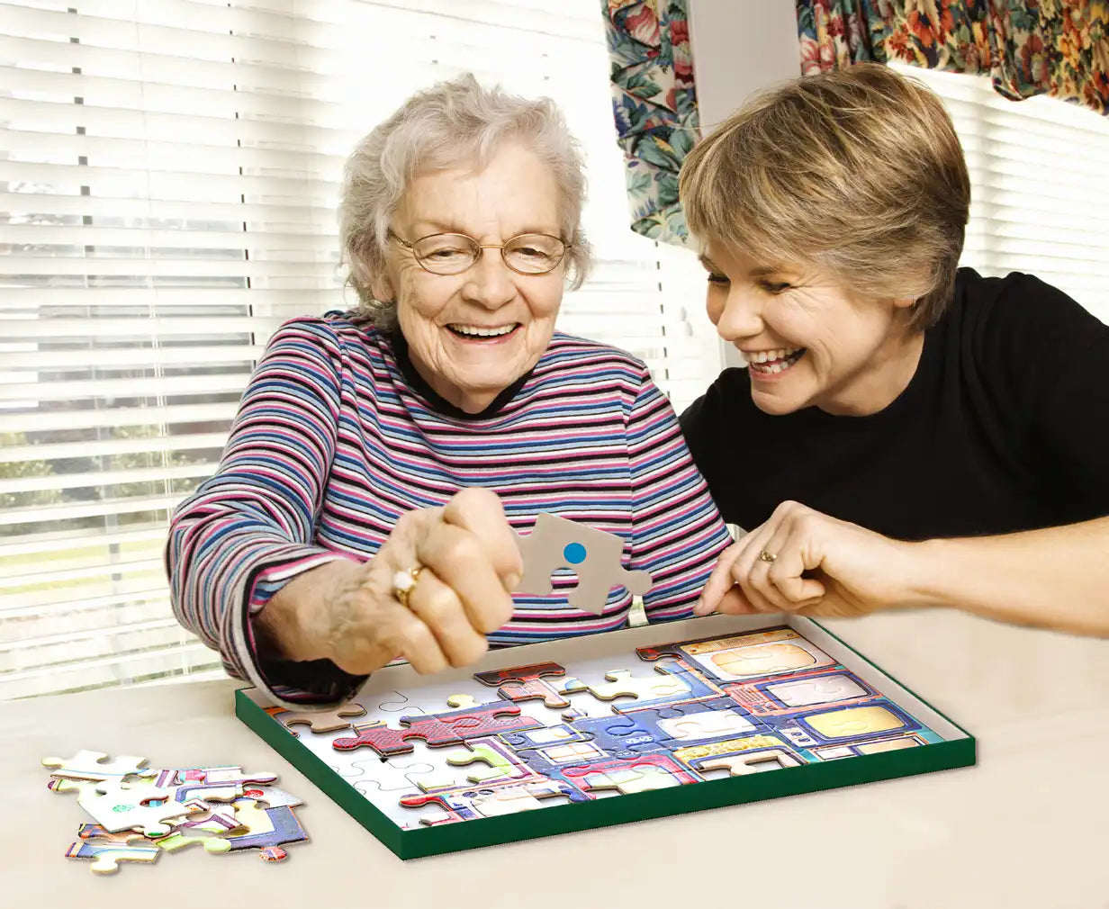 elderly woman doing tv puzzle