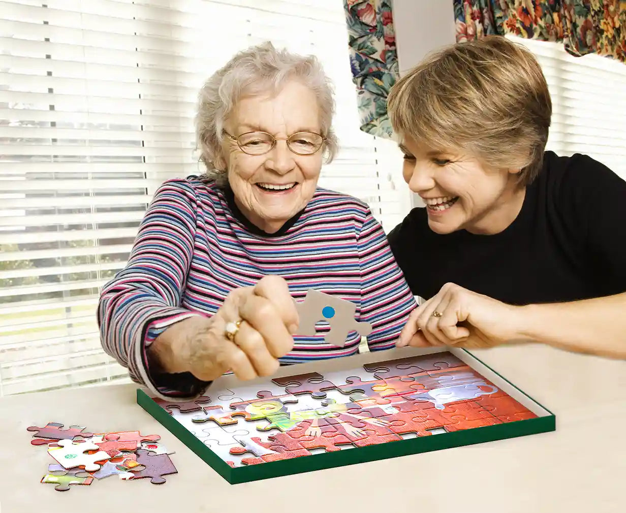 elderly woman doing kitchen puzzle