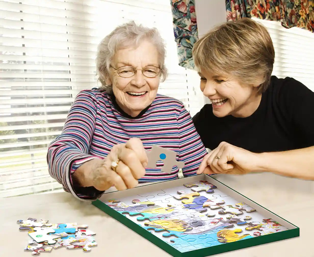 elderly woman doing bird puzzle