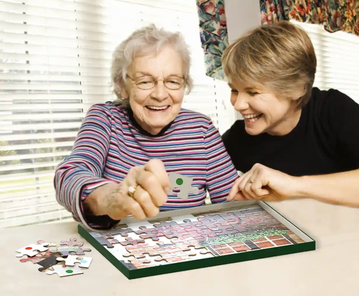 Elderly women doing retro ride jigsaw puzzle smiling