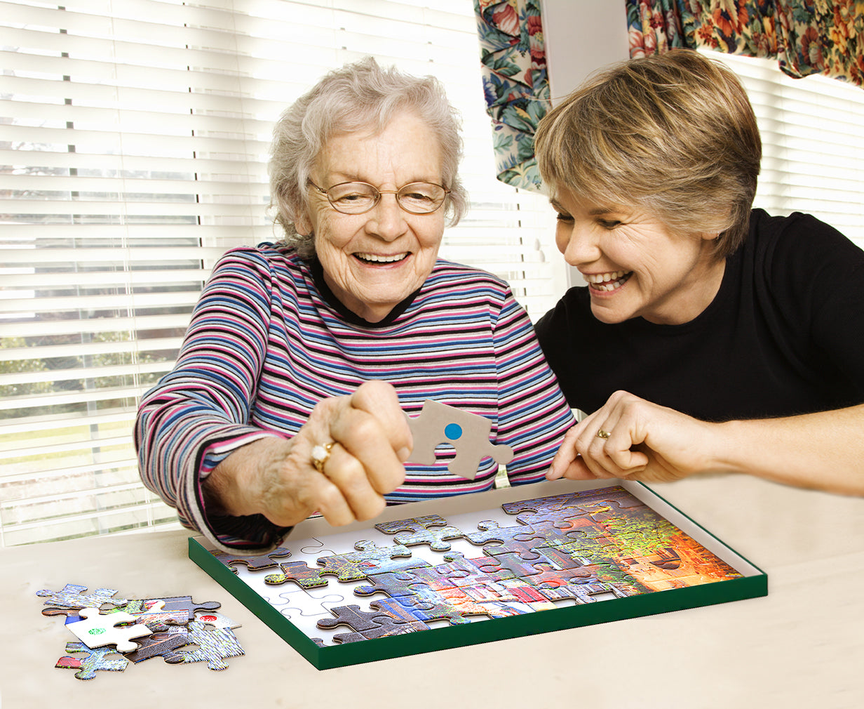elderly woman doing town puzzle