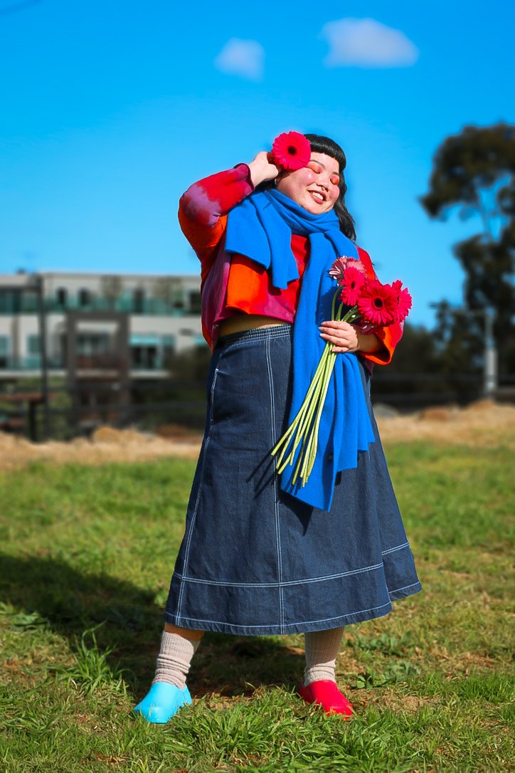 Nadia wears: Fool red jumper, Kowtow denim skirt, Vintage blue scarf, Birkenstock mismatched clogs, Models own socks. Photo by Hayley Hughes