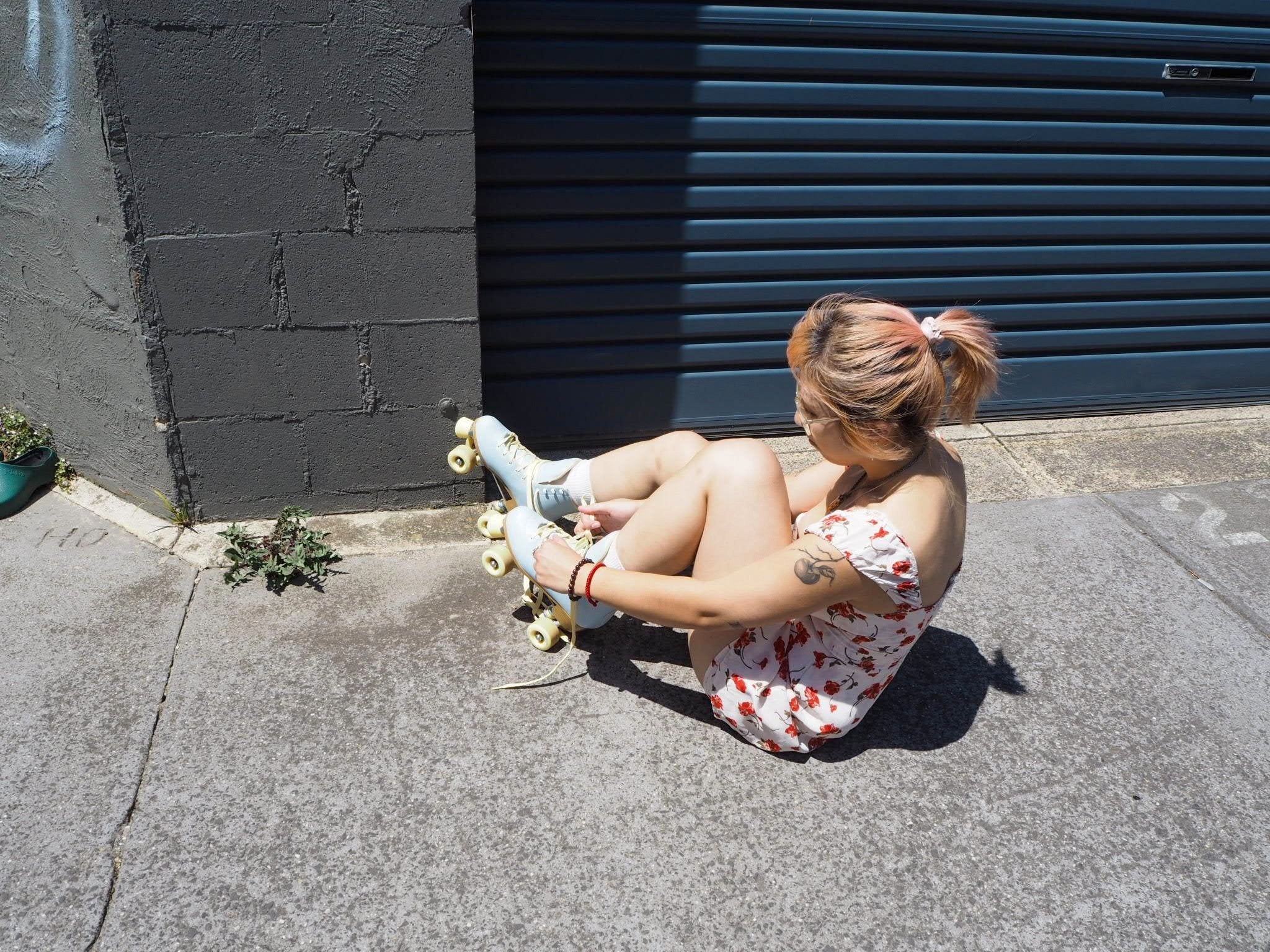 Ren wears: Reformation dress and Impala skates. Photo by Kits Robertson.