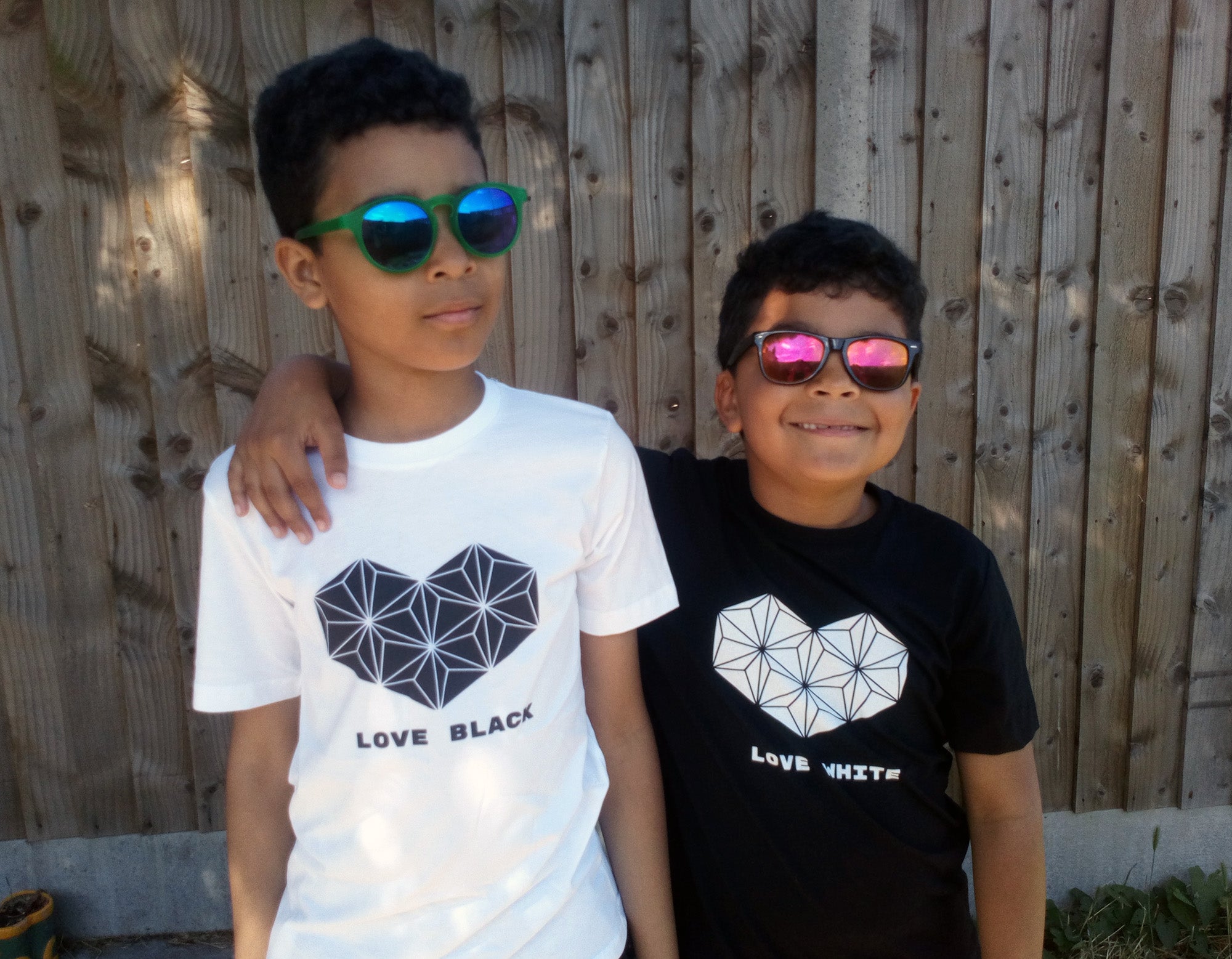 unamarz Creations. The artist's sons wearing the kids T-shirts "Love Black, Love White" and "Love White, Love Black"