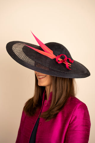 large black hat with pink feather detail for ascot, the races, wedding hats