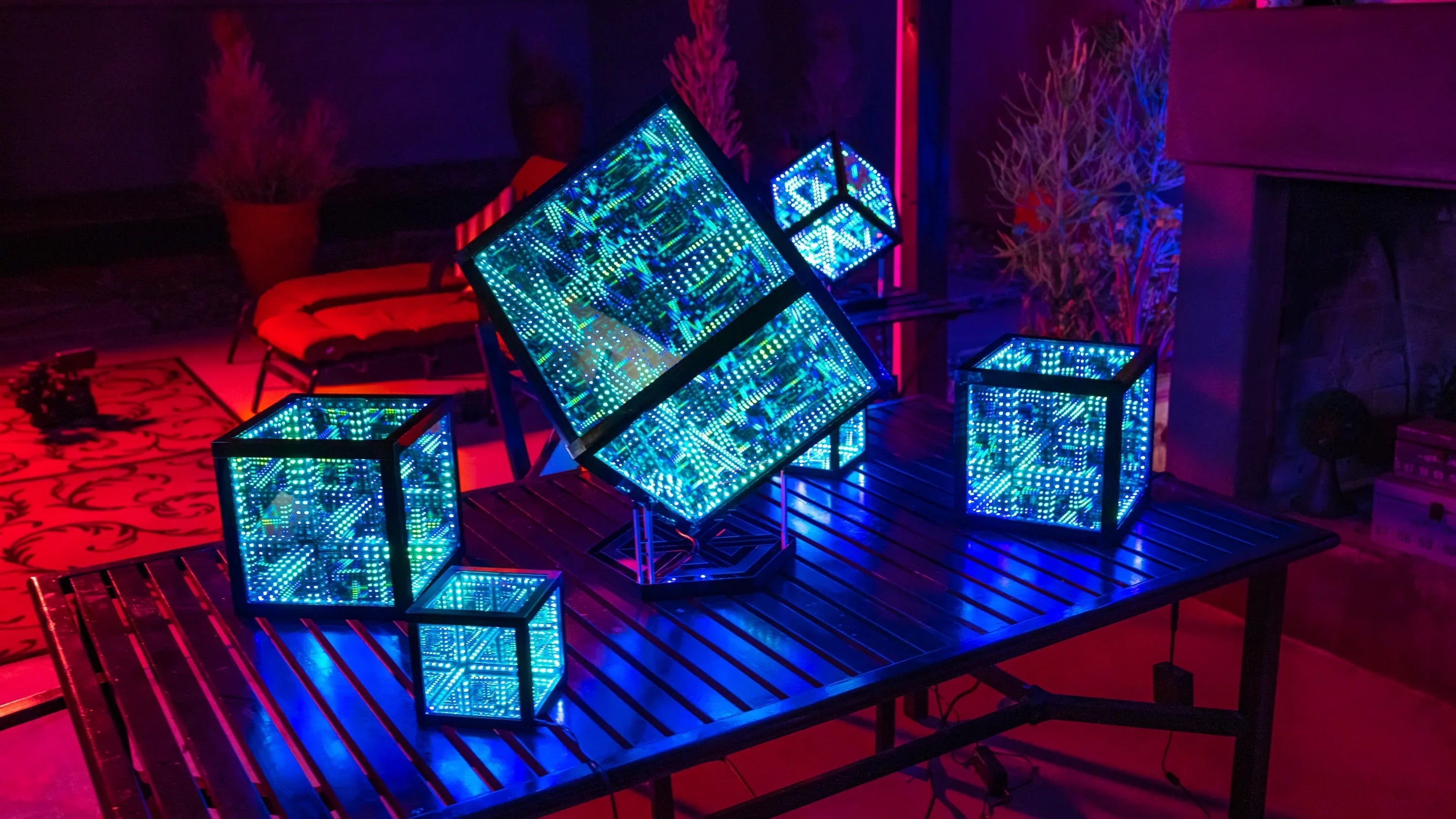 Six HyperCubes placed on outside patio table, near seats, as part of owner’s decorative lighting ideas