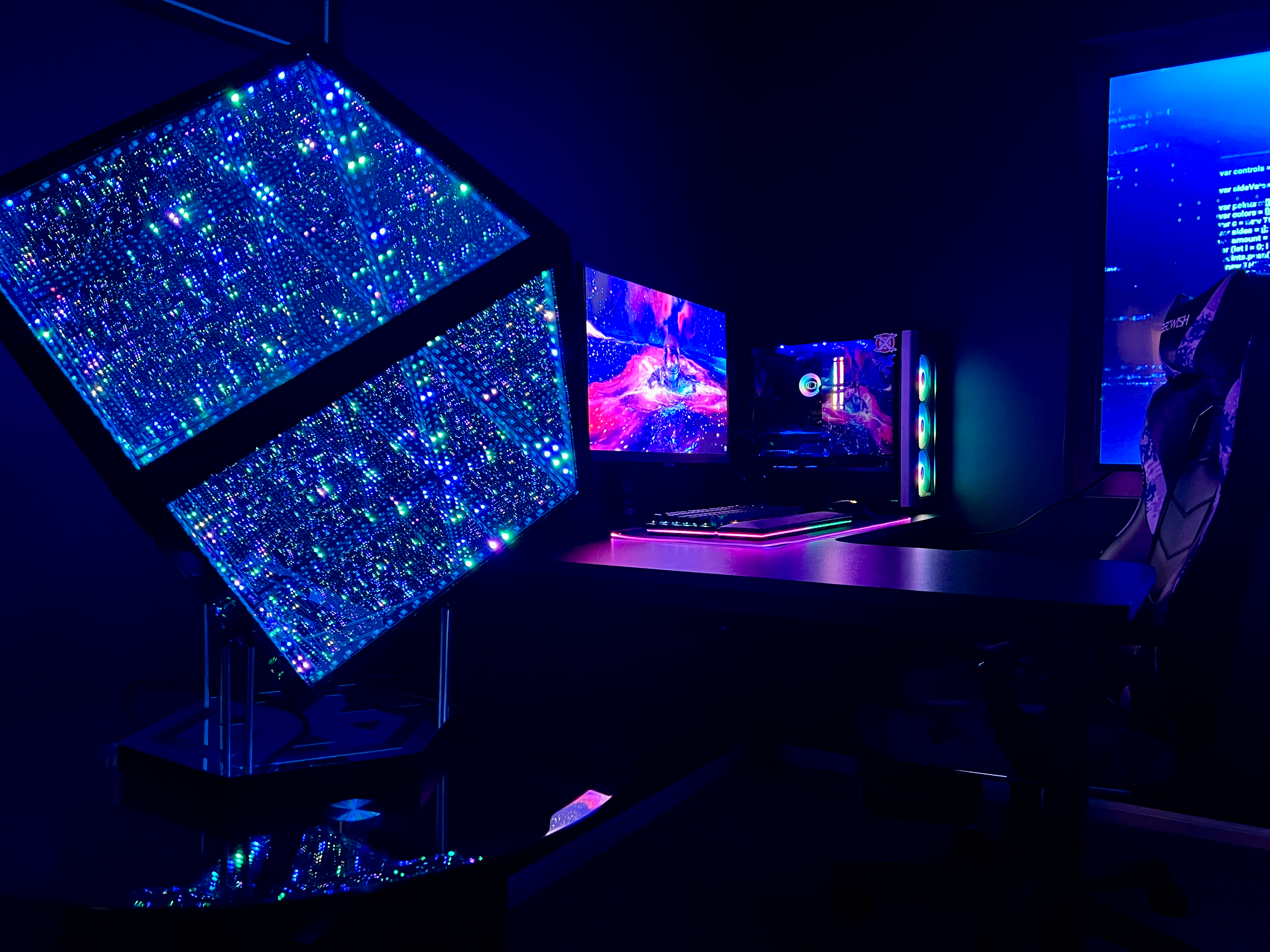 Gamer room with computer and a HyperBox with infinite lights next to it