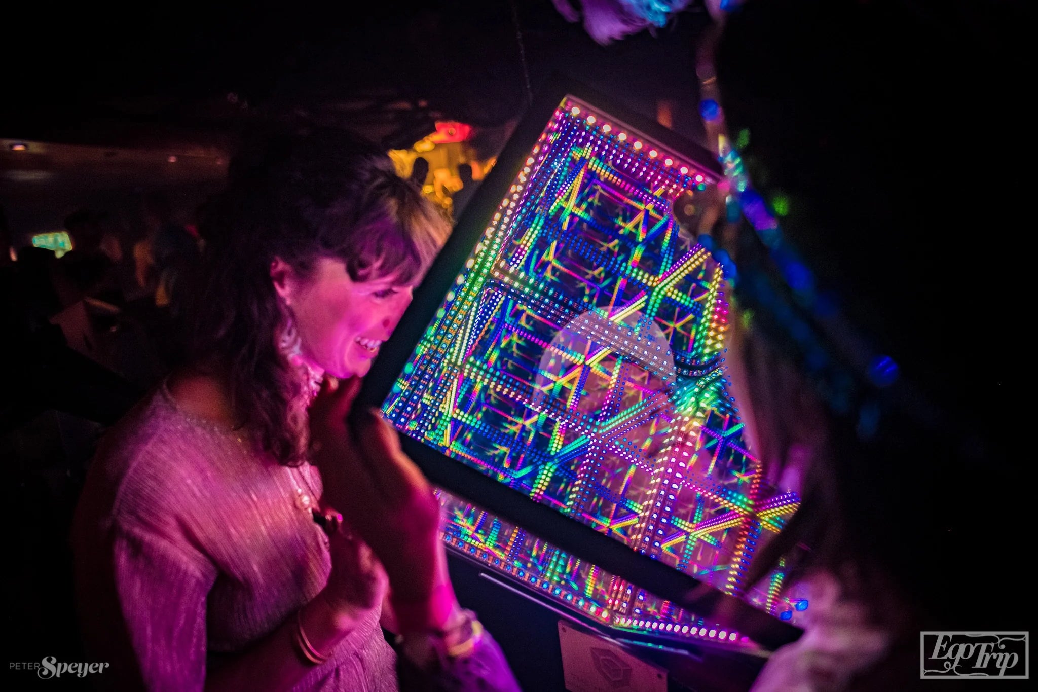 friends looking into multi colored cube