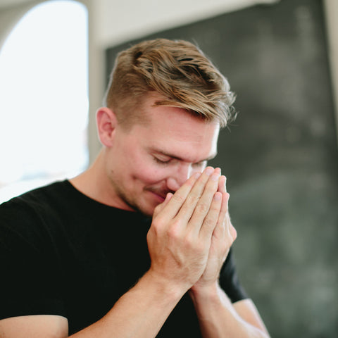 A person taking a Saje breath