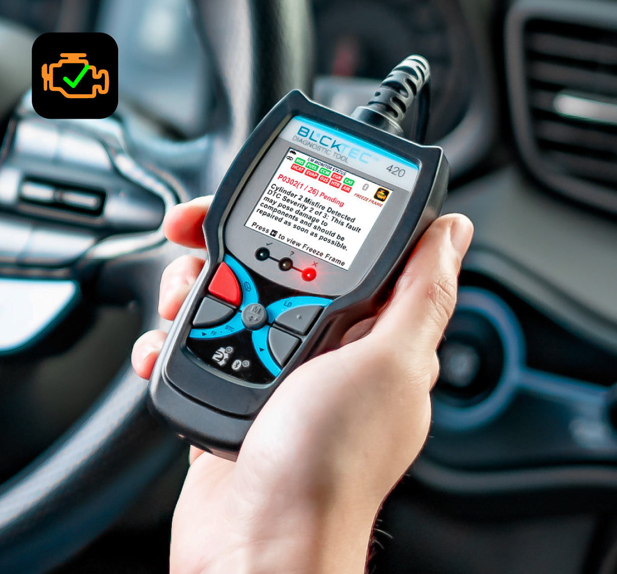 Man's hand holding a wired BLCKTEC 420 OBD2 scanner, with a check engine light icon in corner