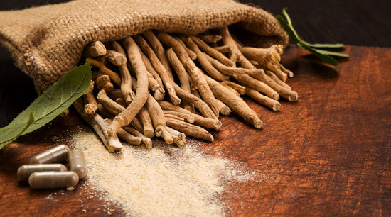 Photo of Ashwagandha Root, Powder and Capsules on a Wooden Table