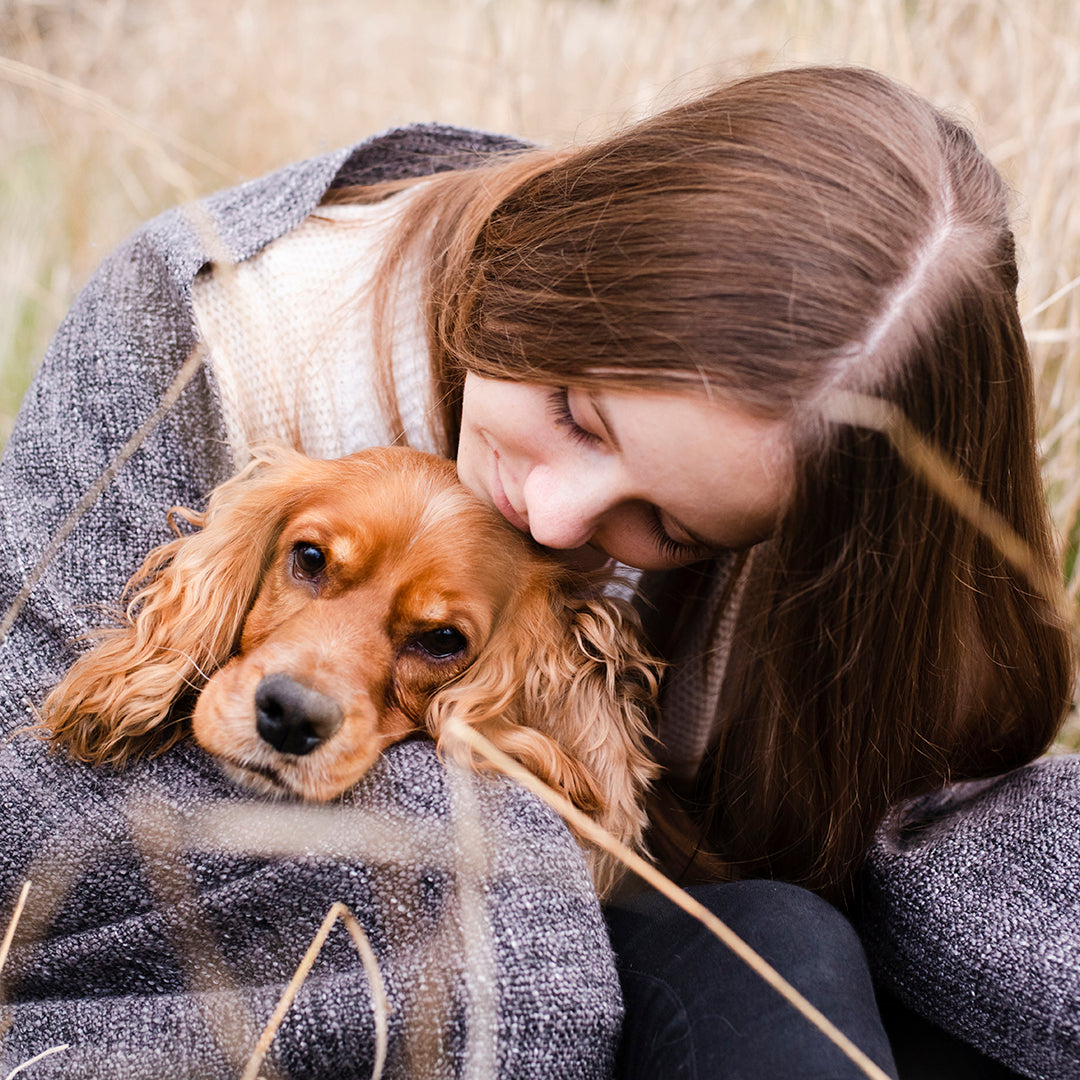 portrait-woman-holding-her-dog