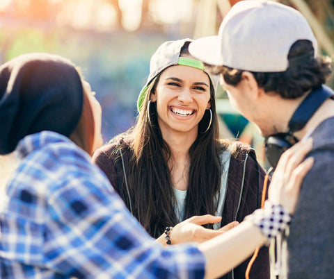 A group of friends outdoors laughing together