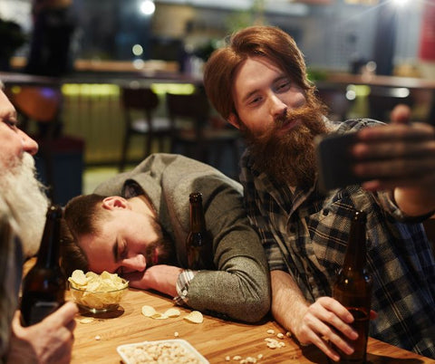 Man takes selfie with his friend who appears to have passed out from drinking