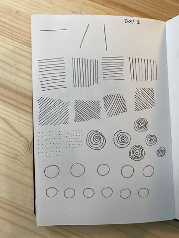 Paper with vertical and horizontal lines, circles and spirals