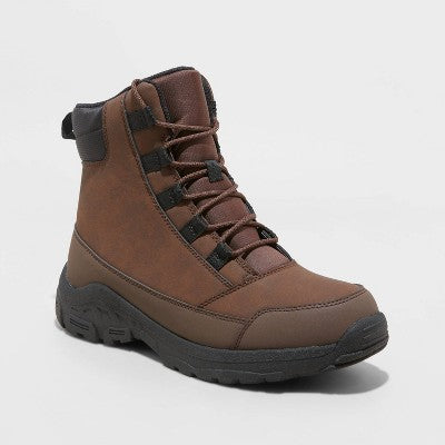 Brown hiking boot with black laces and a thick black sole.