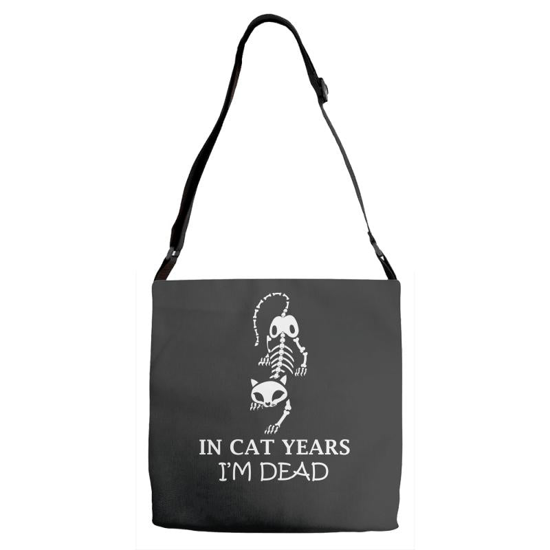 in cat years i'm dead Adjustable Strap Totes