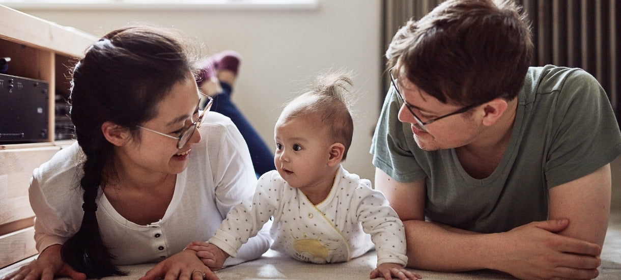 Tummy time is a great time for other family members to bond with baby