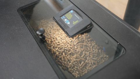 Image of a Harman Absolute63 hopper full of Lignetics wood pellets