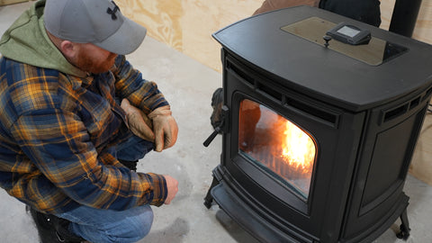 a photo of Mike looking at the flames of the Harman Absolute63 pellet stove