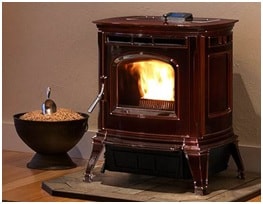 Pellet stove with a bowl of pellets nearby