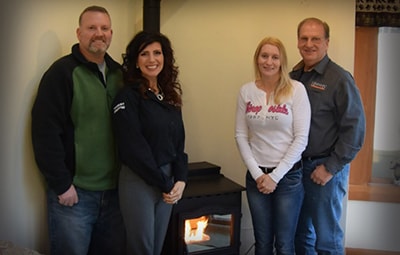 Winners posing next to their new stove