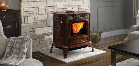An image of a Harman XXV-TC pellet stove on top of a white marble hearth pad