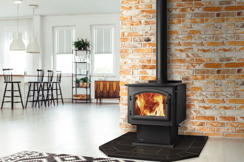 An image of a Quadra-Fire Millennium wood stove in a living/dining room area