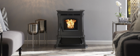 an image of a Harman Absolute pellet stove with decorative emtal pellet storage containers