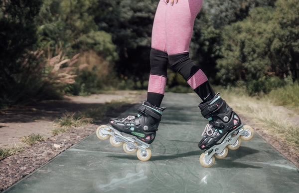 Woman wearing roller skate knee pads