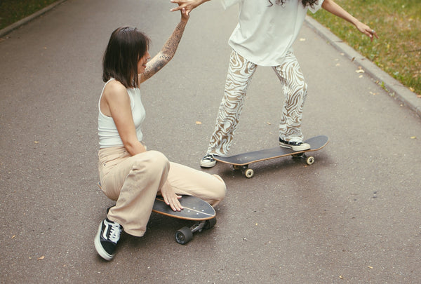 Two women on skateboards