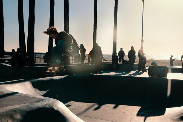 A man doing a skateboard trick at a skate park