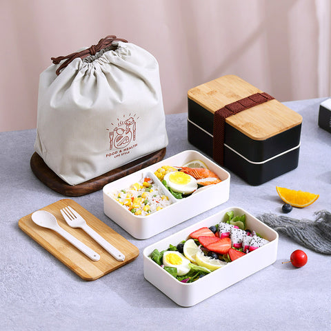 bento box de couleur noir avec sac de transport blanc