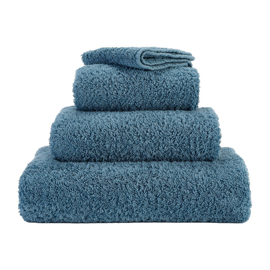 https://cdn.shopify.com/s/files/1/0664/9312/0730/products/luxury-super-pile-blue-egyptian-cotton-towel-by-abyss-habidecor-306-bluestone-739830.jpg?v=1686864384&width=533