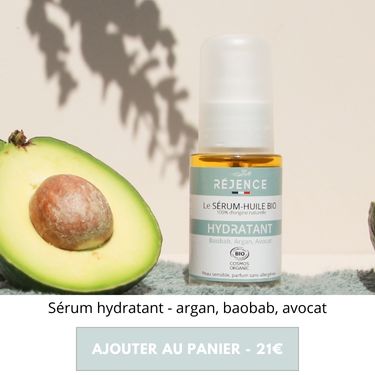 Serum-huile apaisant à côté d'un avocat