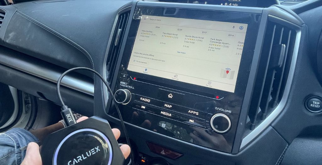 A person using CarPlay in a car