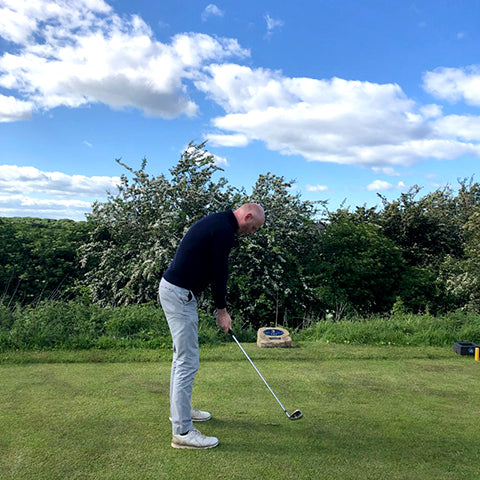 Man playing golf