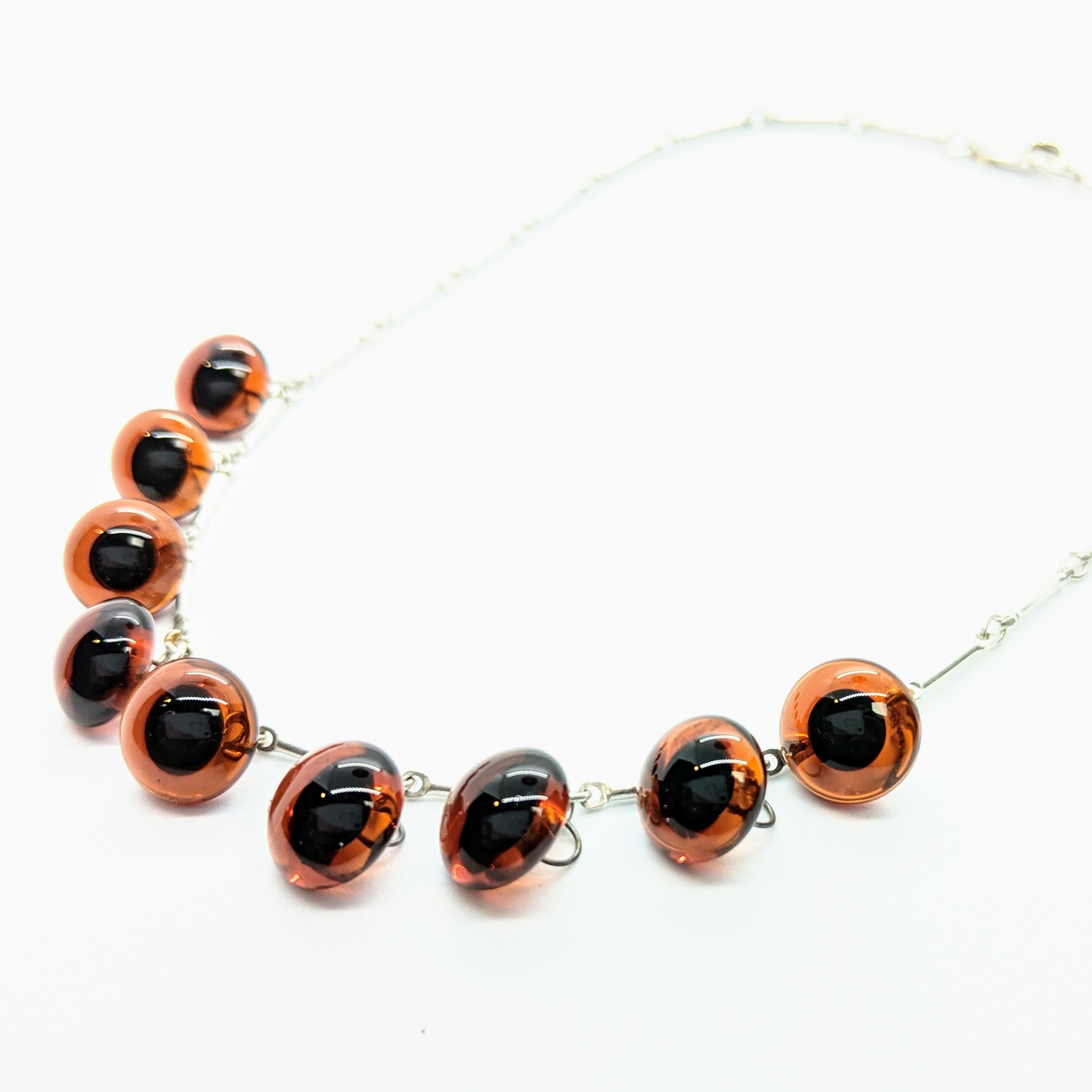 Amber teddy bear eye charm necklace