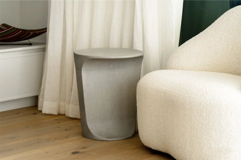 Blend Concrete Design Alpine Concrete Side Table in living room space with curtain behind
