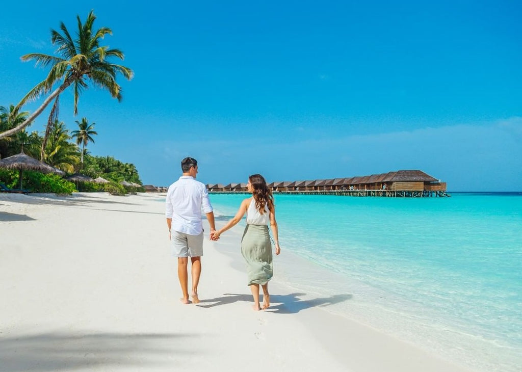 couple beach maldives