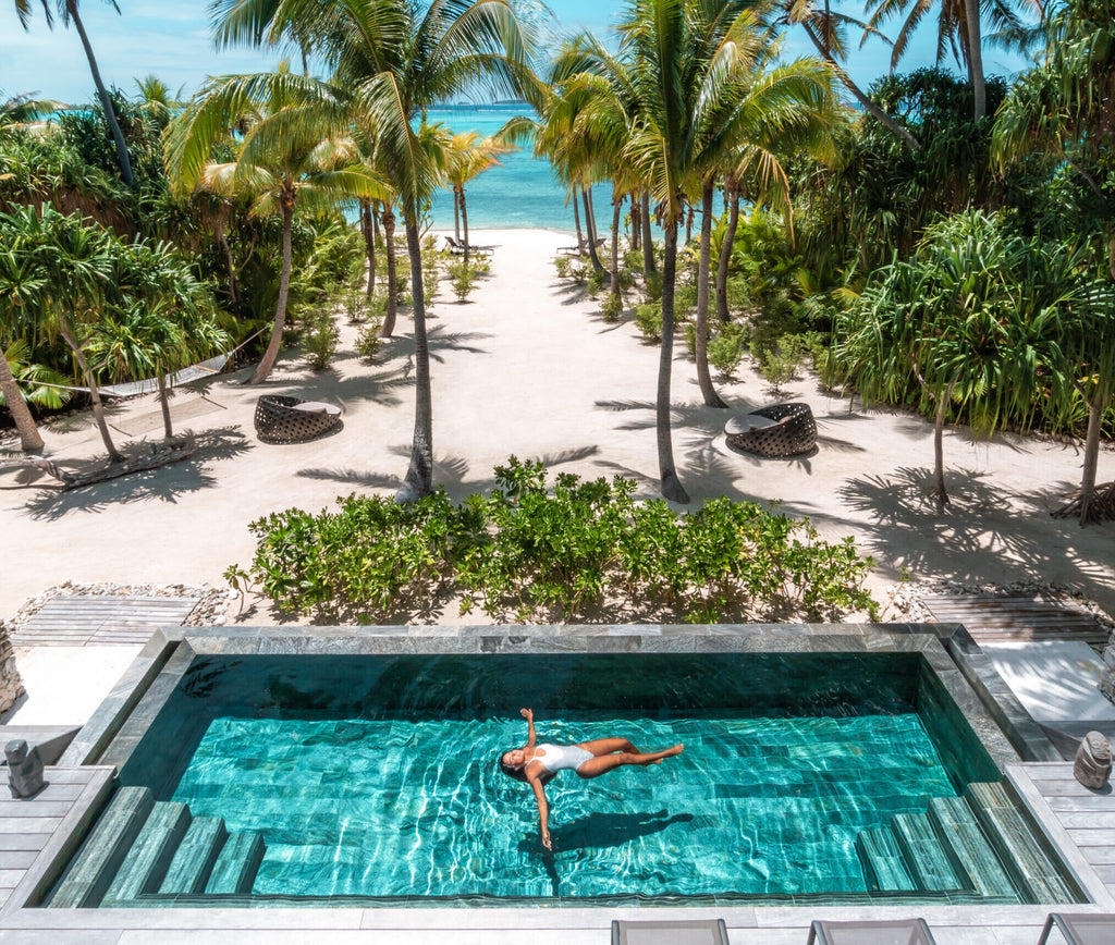 The Brando woman swimming - How to Plan and What to Pack For Your All-Inclusive Resort Vacation