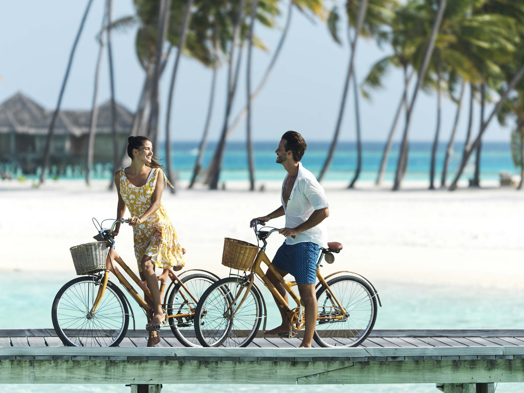 couple biking beach
