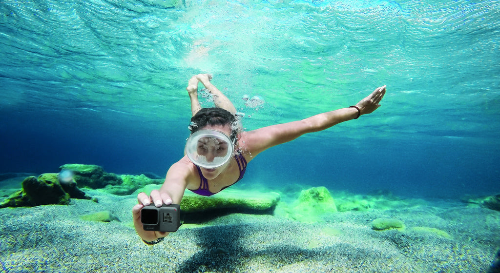 girl snorkeling camera