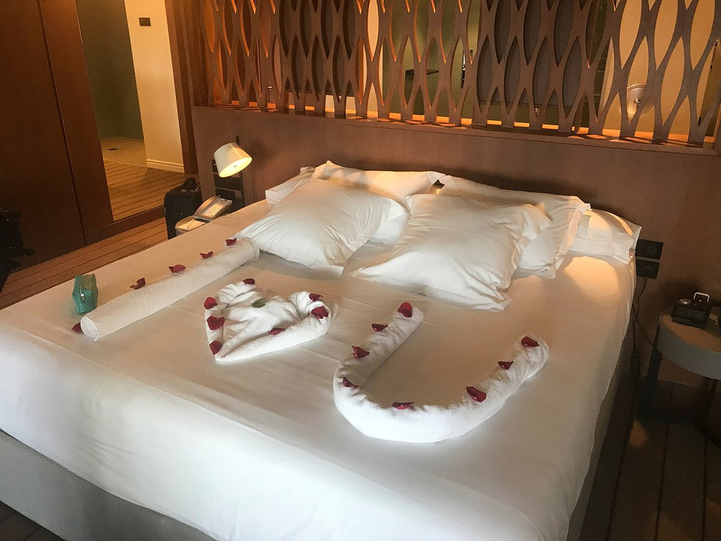 Junior suite room bed with rose petals - Excellence Oyster Bay Review - All Inclusive Resort in JAMAICA