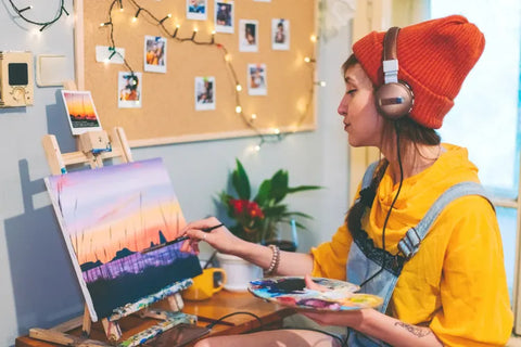 a girl painting a picture