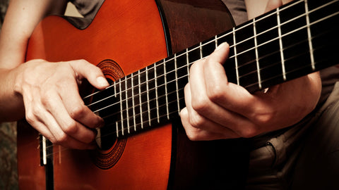 Woman playing classical guitar