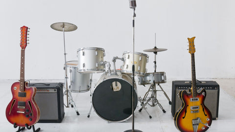 Range of instruments from left to right: guitar, amp, drum kit, bass