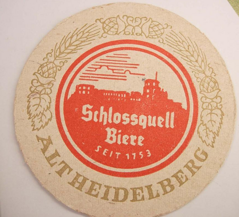 a circular coaster featuring the Schlossheilbier logo