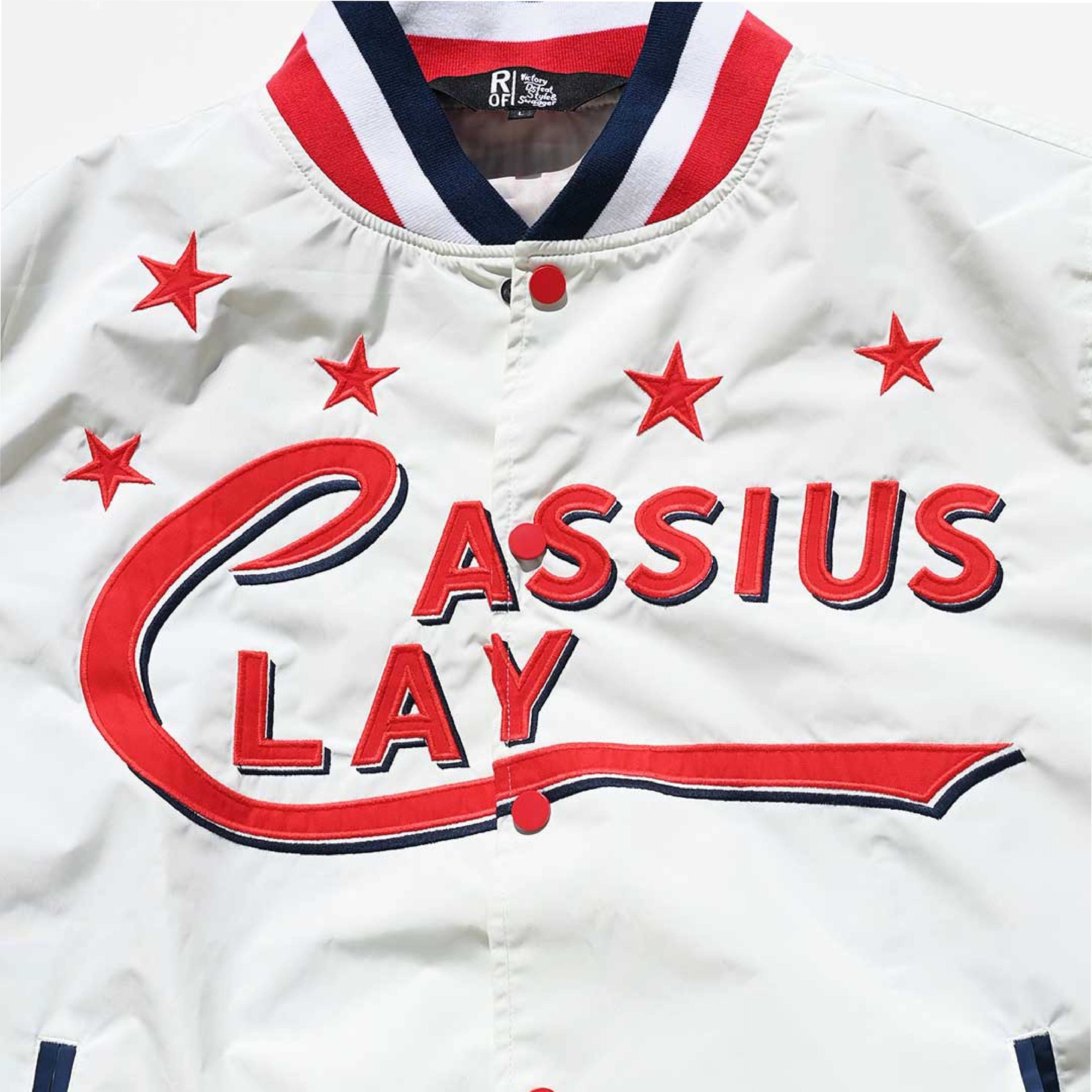 Vintage-style baseball jersey with the name 'Cassius Clay' embroidered on it.