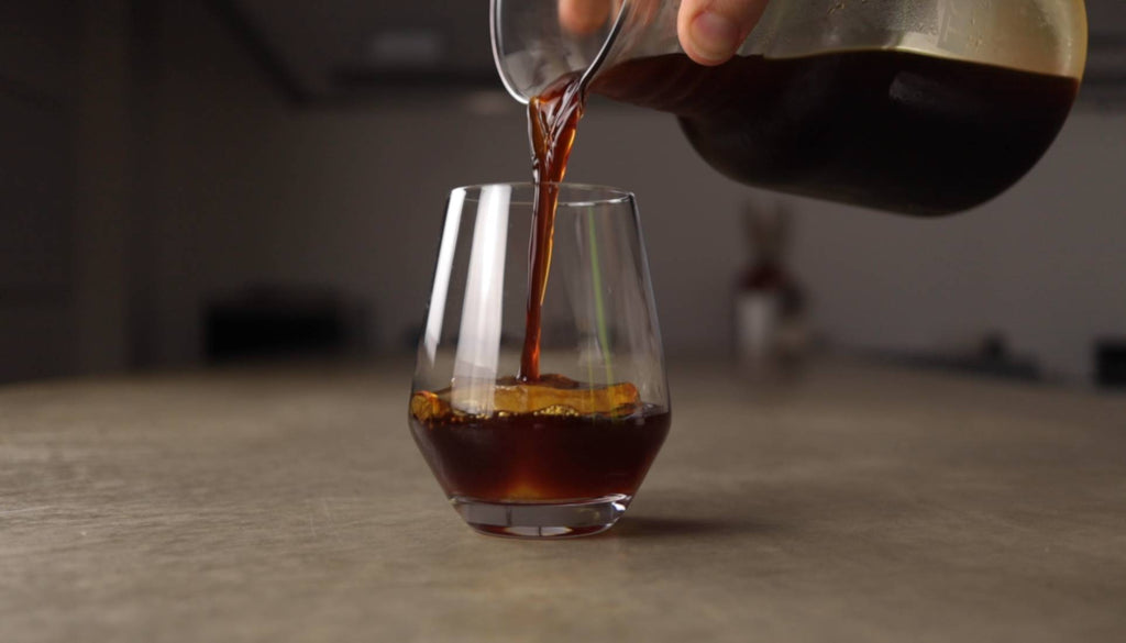 cold brew coffee pouring over ice